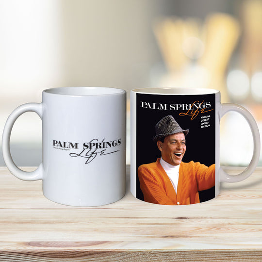 Two ceramic mugs, one with a plain white design and the other featuring a printed design with an image of Frank Sinatra and the text 'Palm Springs Life'.